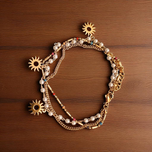 Elegant Gold & Pearl Triple Chain Bracelet with Sun Charms
